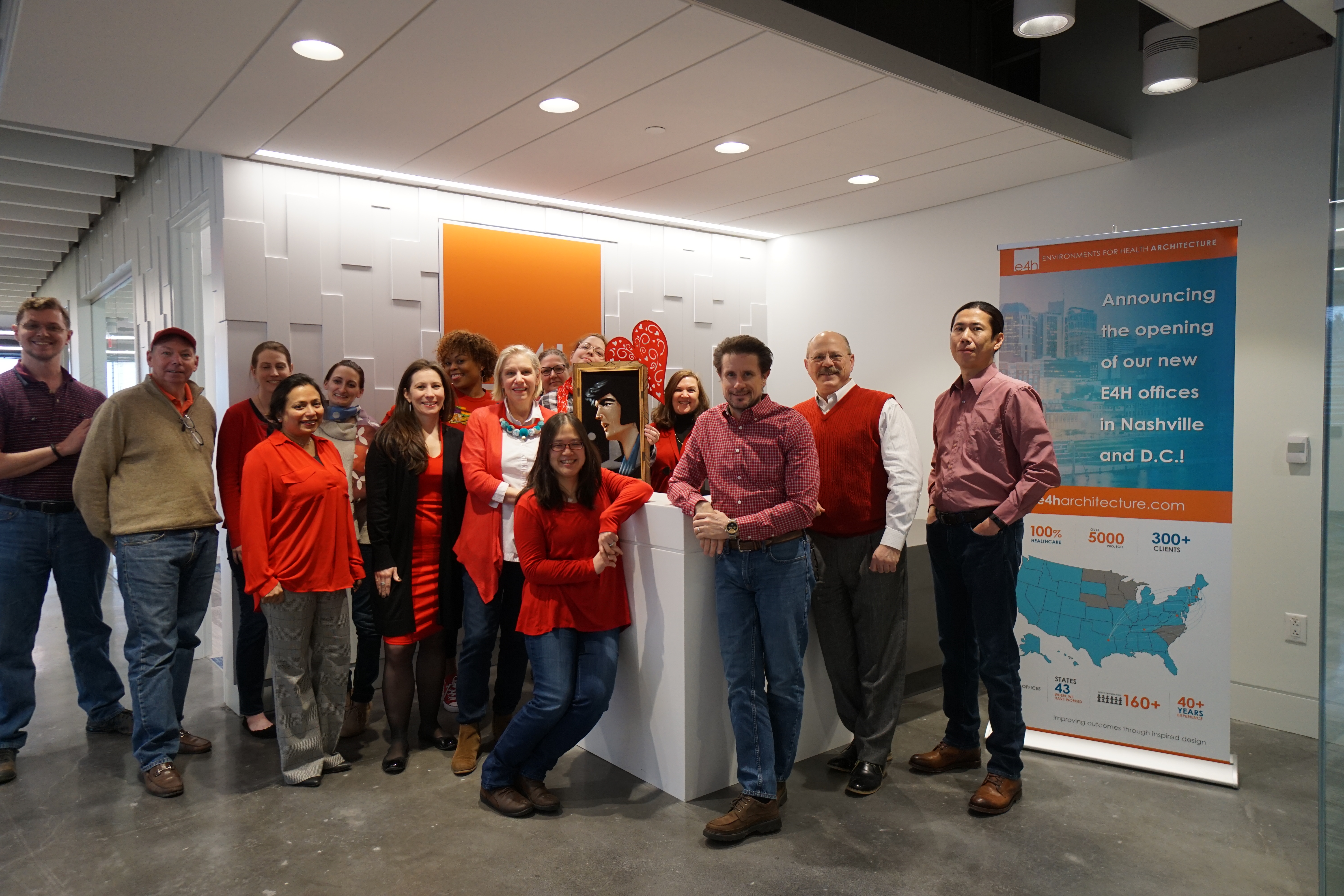 Washington DC team wearing red in front of reception desk
