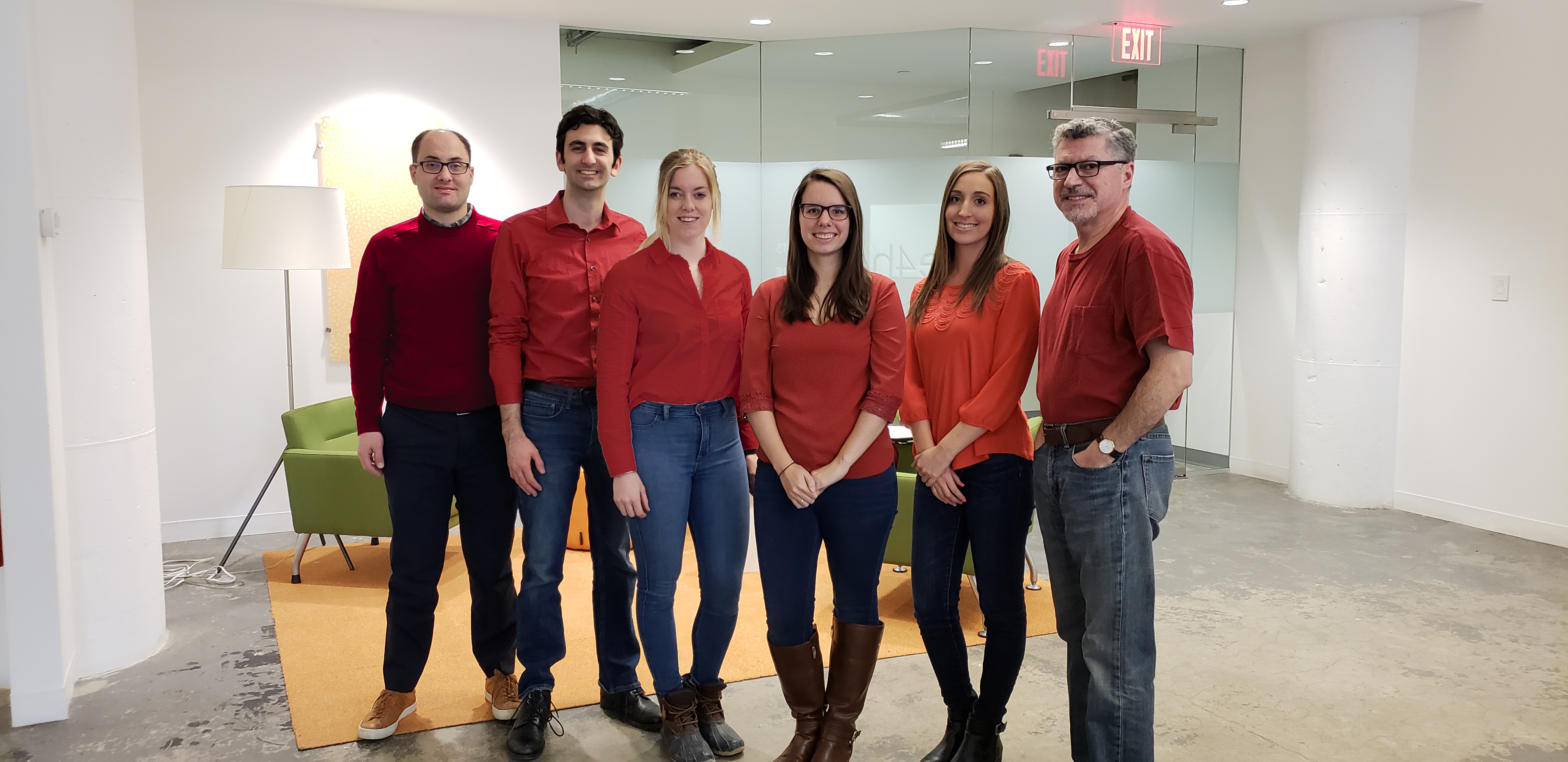 Boston team in red shirts and jeans on wear red day