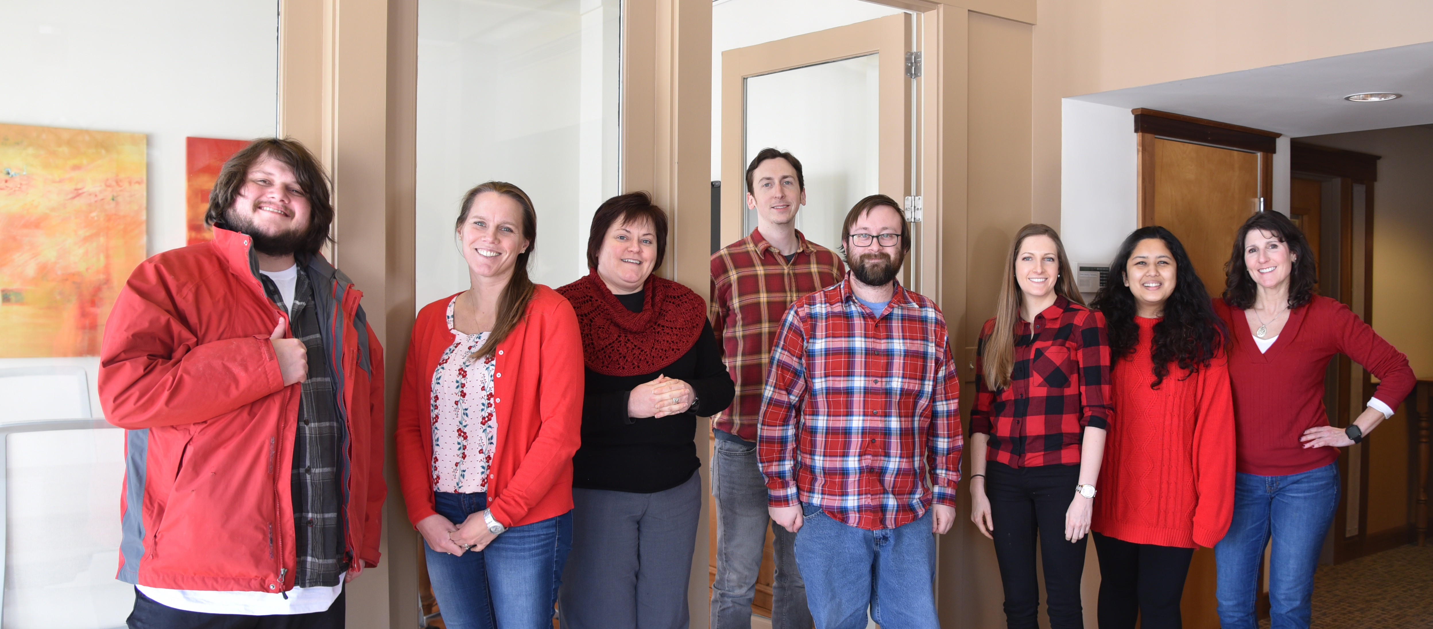 E4H Vermont employees wearing red shirts in office