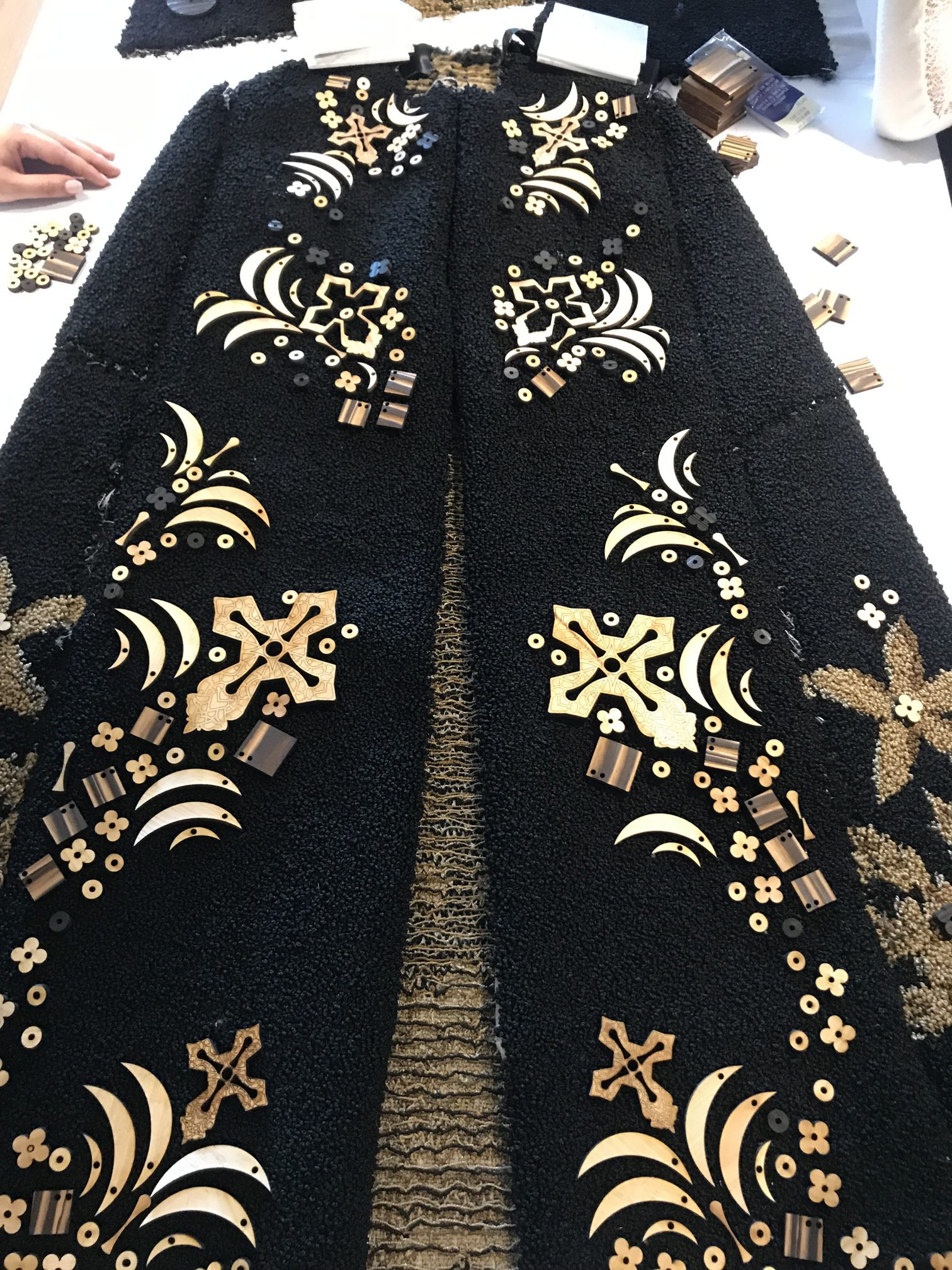 Black and gold jacket with wooden details