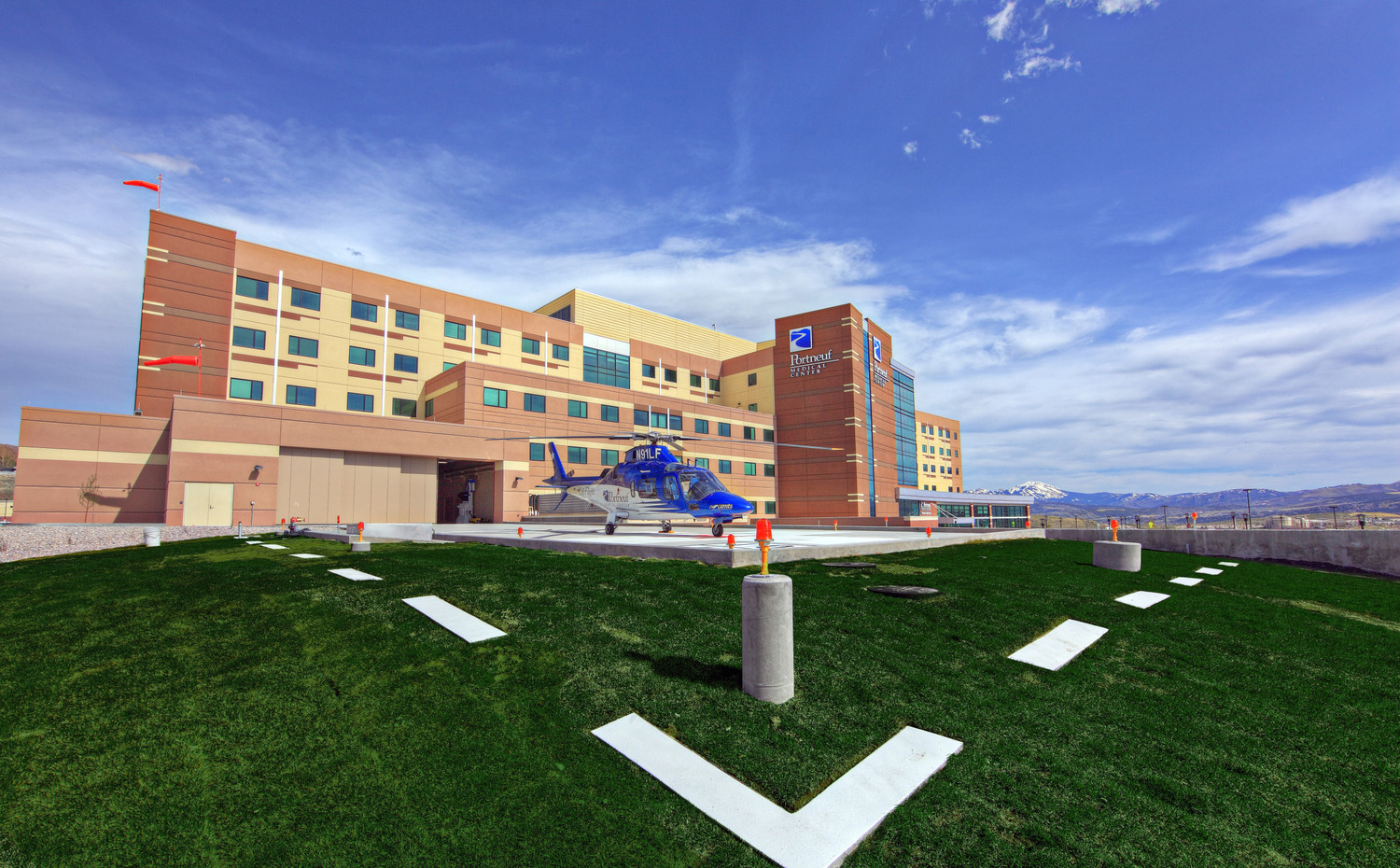 Portneuf Medical Center exterior with green grass and helicopter landing pad