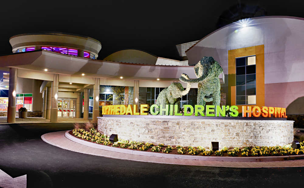 Blythedale Children’s Hospital building front with sign and topiary elephants