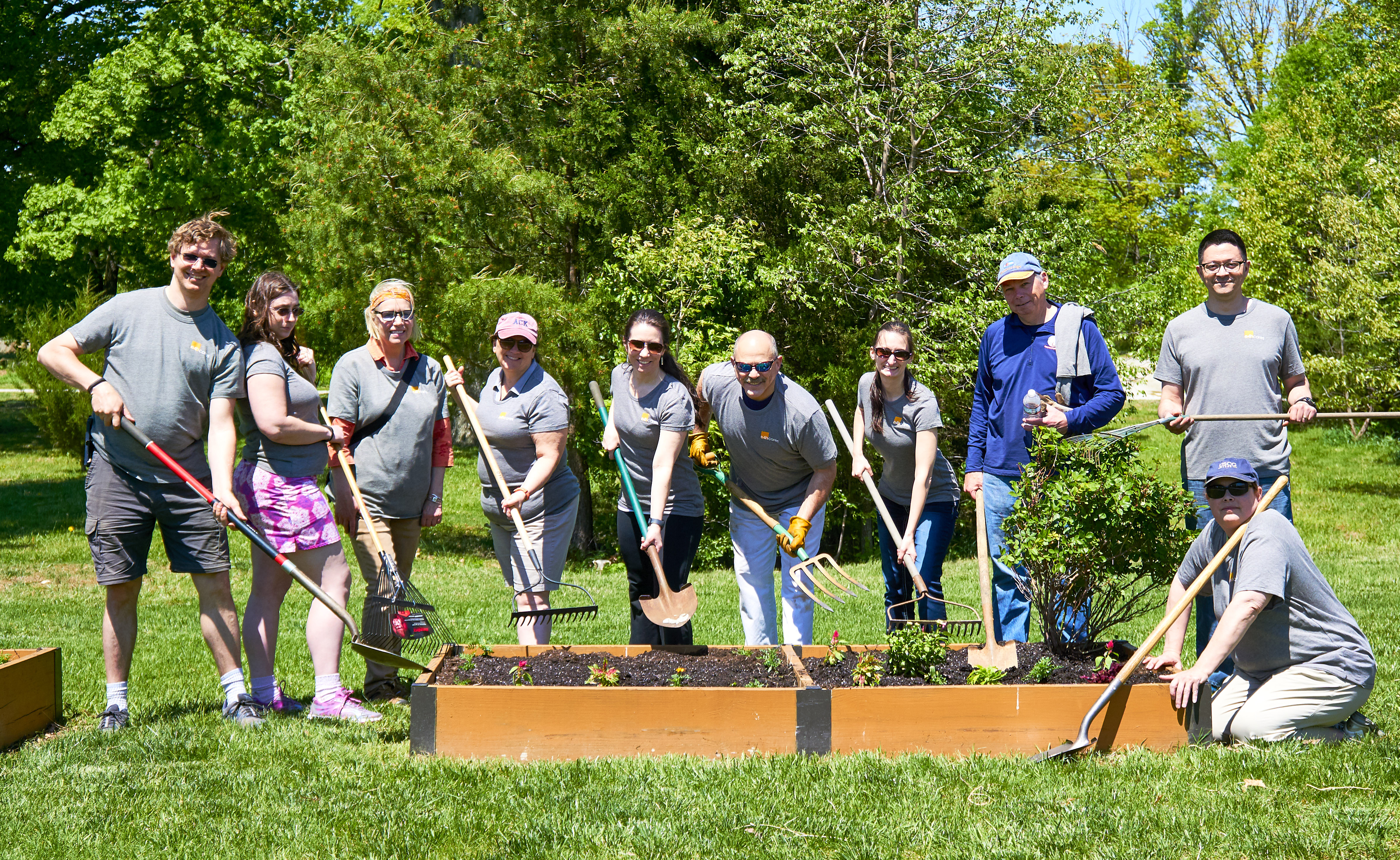 E4H team members with plant boxes gardening for veterans at Fort Belvoir Military Base
