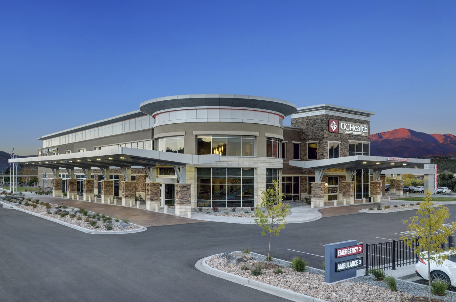 UCHealth exterior view with emergency and ambulance signs visible